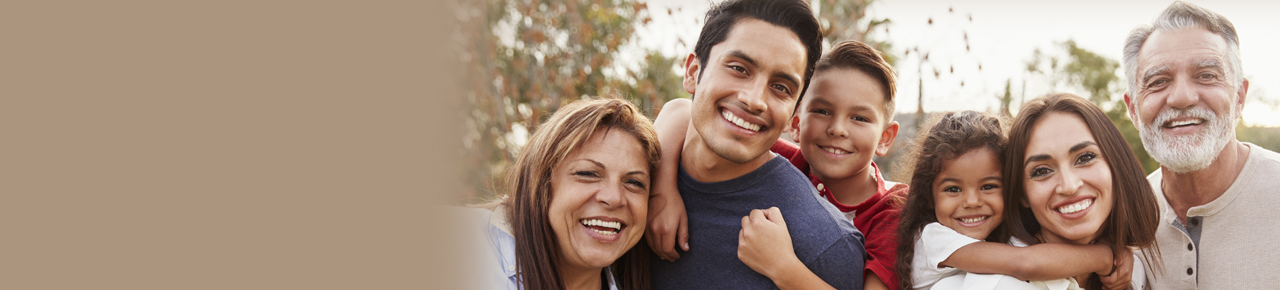 Multigenerational family of six smiling and laughing